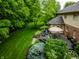 Backyard featuring a spacious deck with outdoor seating, a grill, and lush landscaping at 14274 Matt St, Carmel, IN 46033