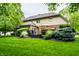 Expansive backyard featuring a well-maintained lawn and a spacious deck with patio furniture at 14274 Matt St, Carmel, IN 46033