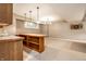Basement bar featuring warm wood tones, ample counter space, and seating, creating an inviting atmosphere at 14274 Matt St, Carmel, IN 46033