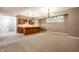Finished basement with a bar area, carpeted floors, and neutral paint, perfect for entertaining or relaxation at 14274 Matt St, Carmel, IN 46033