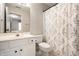 Clean bathroom with a white vanity and a shower/tub combo with a decorative curtain at 14274 Matt St, Carmel, IN 46033
