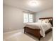 Neutral bedroom with a window, carpet, and a bed with soft linens at 14274 Matt St, Carmel, IN 46033