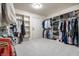Spacious walk-in closet with custom built-in shelving and rods for optimal storage at 14274 Matt St, Carmel, IN 46033