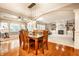 Open-concept dining area with stylish light fixture and ample natural light flowing into the adjacent living area at 14274 Matt St, Carmel, IN 46033