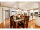 Charming dining area featuring hardwood floors and views into the kitchen with stainless steel appliances at 14274 Matt St, Carmel, IN 46033
