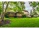 Spacious backyard with mature trees and well-maintained lawn, showcasing the home's beautiful outdoor setting at 14274 Matt St, Carmel, IN 46033