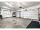 Spacious two-car garage with ample storage space and bright lighting, perfect for parking and organization at 14274 Matt St, Carmel, IN 46033
