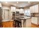 Modern kitchen with granite countertops, stainless steel appliances, and a center island with seating at 14274 Matt St, Carmel, IN 46033