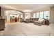 Open-concept living room flowing into the dining area, a fireplace, and comfortable seating arrangement at 14274 Matt St, Carmel, IN 46033