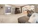 Comfortable living room features a fireplace, a TV, and an open flow into the dining and kitchen areas at 14274 Matt St, Carmel, IN 46033
