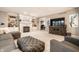 Spacious living room featuring a fireplace, built-in shelving, and modern entertainment center at 14274 Matt St, Carmel, IN 46033