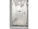 Elegant glass enclosed shower is accented by subway tile surround, granite bench and a rainfall showerhead at 14274 Matt St, Carmel, IN 46033