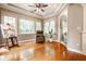 Bright sunroom with hardwood floors, a tray ceiling, and large windows offering plenty of natural light at 14274 Matt St, Carmel, IN 46033