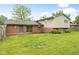The backyard features a patio area extending from the house, ideal for outdoor relaxation and entertainment at 1440 Fenwick Ave, Indianapolis, IN 46219