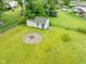 Backyard features a storage shed and fire pit, offering practical storage and a cozy gathering spot at 1440 Fenwick Ave, Indianapolis, IN 46219