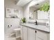 Bathroom featuring granite countertops, modern fixtures, a shower with curtain, and tasteful artwork at 1440 Fenwick Ave, Indianapolis, IN 46219