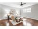 Bedroom with hardwood floors, ceiling fan, and decor at 1440 Fenwick Ave, Indianapolis, IN 46219