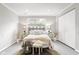 Relaxing bedroom with neutral tones, featuring ample natural light and closet space at 1440 Fenwick Ave, Indianapolis, IN 46219