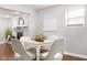 Charming dining area with fireplace and stylish decor with hardwood floors at 1440 Fenwick Ave, Indianapolis, IN 46219
