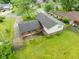 Aerial view of a two-story home showing the backyard and brick accents, with a lush green lawn at 1440 Fenwick Ave, Indianapolis, IN 46219