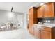 Kitchen and dining area with tile flooring and light wood cabinets at 1440 Fenwick Ave, Indianapolis, IN 46219