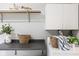Well-organized laundry area with counter space, shelving, and storage baskets at 1440 Fenwick Ave, Indianapolis, IN 46219