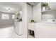 Functional laundry room with washer, dryer, and ample storage at 1440 Fenwick Ave, Indianapolis, IN 46219