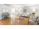 Inviting living room with hardwood floors, neutral decor, comfortable seating, and plenty of natural light at 1440 Fenwick Ave, Indianapolis, IN 46219