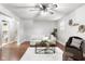 Open-concept living room with hardwood floors, a plush sofa, a stylish coffee table, and modern decor at 1440 Fenwick Ave, Indianapolis, IN 46219