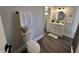 Updated bathroom featuring a toilet, vanity, updated lighting, and modern finishes at 1440 Sycamore St, Columbus, IN 47201