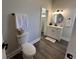 Contemporary bathroom featuring a toilet, vanity, and updated finishes at 1440 Sycamore St, Columbus, IN 47201