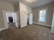 Bedroom with connecting doors and windows allowing natural light to brighten the space at 1440 Sycamore St, Columbus, IN 47201