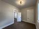 Bedroom with overhead lighting, fresh paint, and stylish neutral decor at 1440 Sycamore St, Columbus, IN 47201