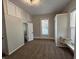 Bedroom featuring carpet, windows, and closet with storage at 1440 Sycamore St, Columbus, IN 47201