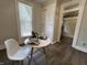 Cozy dining area featuring seating for two, a window with natural light and modern accents at 1440 Sycamore St, Columbus, IN 47201