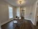 Bright dining area with table set for two, complemented by modern lighting and neutral tones at 1440 Sycamore St, Columbus, IN 47201