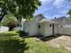Exterior showing a house with vinyl siding, a grassy yard and a wood fence at 1440 Sycamore St, Columbus, IN 47201