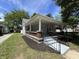 Charming house featuring a cozy front porch and a well-manicured landscaped yard at 1440 Sycamore St, Columbus, IN 47201