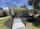 Charming house featuring a cozy front porch and a well-manicured landscaped yard at 1440 Sycamore St, Columbus, IN 47201