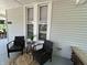 Inviting porch seating area, perfect for relaxation and enjoying the outdoors at 1440 Sycamore St, Columbus, IN 47201