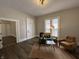 Cozy living room features wood floors and a well-designed furniture layout at 1440 Sycamore St, Columbus, IN 47201
