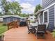 Back deck with seating, a grill, and beautiful landscaping are highlights of this property at 150 E 46Th St, Indianapolis, IN 46205
