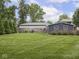 Expansive backyard with manicured lawn and partial fence at 150 E 46Th St, Indianapolis, IN 46205