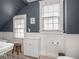 Bathroom with dark blue walls, and white wooden wainscotting at 150 E 46Th St, Indianapolis, IN 46205