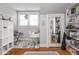 Bedroom featuring hardwood floors and two windows at 150 E 46Th St, Indianapolis, IN 46205