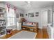 Bedroom with hardwood floors and a window at 150 E 46Th St, Indianapolis, IN 46205