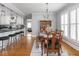 Dining room and kitchen with breakfast bar and seating at 150 E 46Th St, Indianapolis, IN 46205