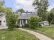 Beautiful home with manicured lawn, walkway, and charming curb appeal at 150 E 46Th St, Indianapolis, IN 46205