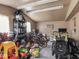 Garage space with storage shelves, bikes, toys, and other items at 150 E 46Th St, Indianapolis, IN 46205