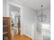 Bright upstairs hallway with chandelier and view to a sitting room at 150 E 46Th St, Indianapolis, IN 46205